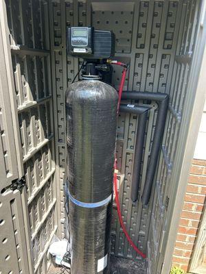 Iron Removal Filter installed outdoors inside of enclosure