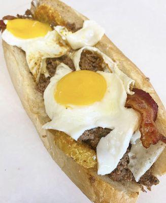 Steak Jay (steak and cheese sub with two sunny side up eggs, bacon, hashbrown, james river bbq sauce)