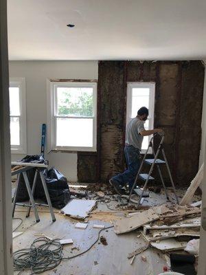 Third floor damage. The water is funning from the roof leak into the ceiling, windows, drywall, and floors.