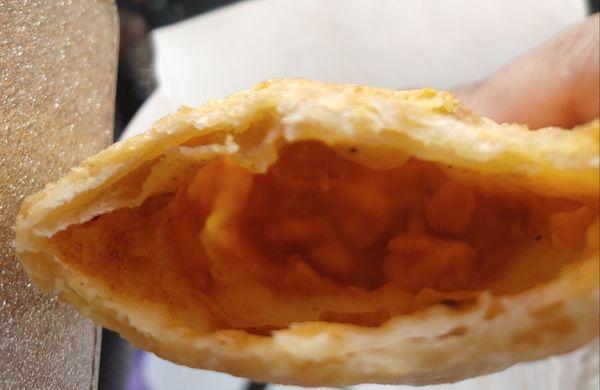 Not even a half filled empanada!