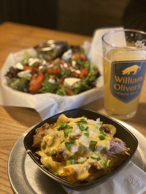 Cajun nachos with beer cheese. In the back the caprese salad