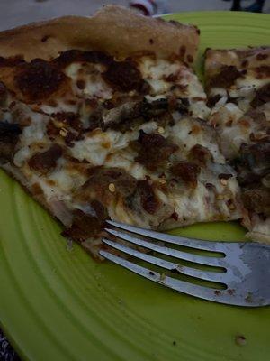 Sausage, mushroom, and onion pizza.