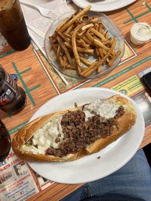 Cheesesteak sub and fries.