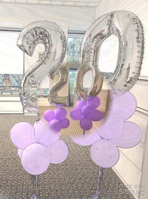 Inflated number and purple balloons with weights delivered on time.