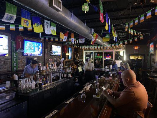 Oval bar with band in the background.