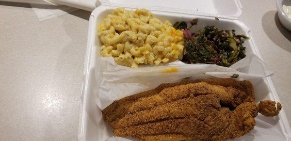 Catfish with homemade mac and cheese and collard greens.