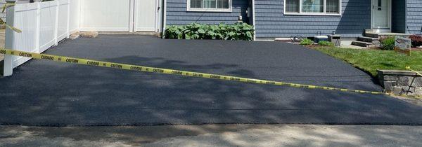 BEAUTIFUL and CLEAN  wider, cleaner and a drain pipe discreetly ran to end of driveway peeking out by the retaining wall on the right.