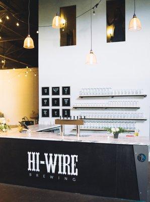 The beautiful bar is fully stocked with Hi-Wire favorites, wine, and cider.