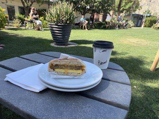 Cortado with Impossible sausage and egg sandwich