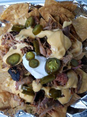 Loaded Nachos Freshly Fried Nacho Chips loaded with Pulled Pork, Nacho Cheese, Jalapenos & Sour Cream $6.00 (limited availability)