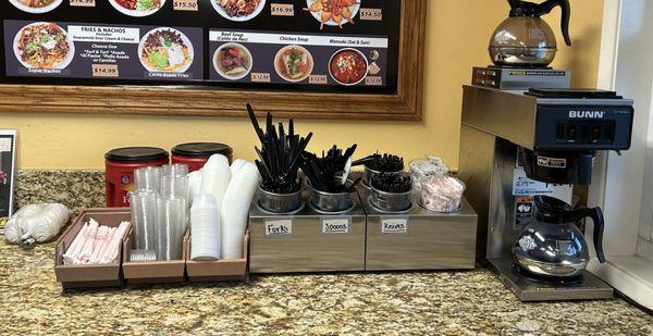 Clean area of utensils and salsa cups, napkins, straws, etc.