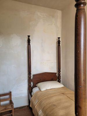 The bedroom of an enslaved worker. This house held four people in slavery, the sister property held 8.