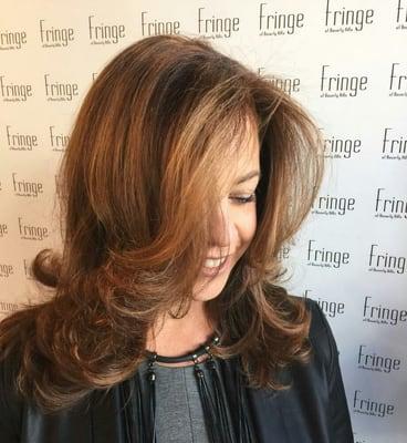 Brunette with warm blonde accent highlights