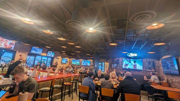 Lotsa TVs,waitstaff will turn your game on request :D Bar, tables, Booths +another separate quieter seating area as you enter.  4-2024