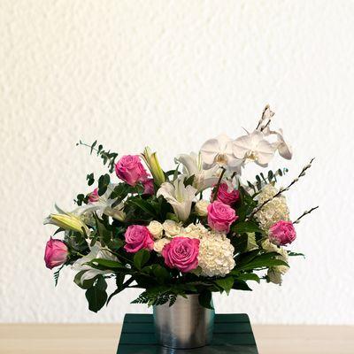 Brighten someone's day with our stunning floral arrangements, thoughtfully designed for any occasion. Call us today to place your order!