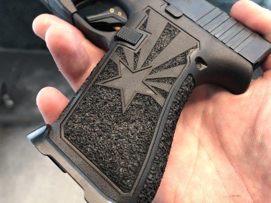 Customer supplied Glock 43x with laser stippling, hand stippling, a magwell, flashlight and a trigger.