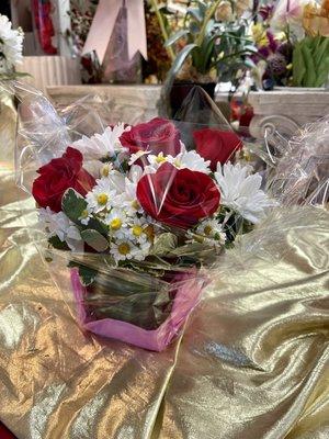 Red roses, white daisies table arrangement ($59)