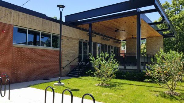 View of the patio and bike parking from westbound University Ave.