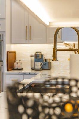 Kitchen remodeling project in Falls Church, VA with white kitchen countertop & wooden flooring