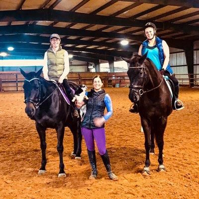 Our awesome hunter/jumper and dressage trainer Allison Tiffert is between two of her clients.