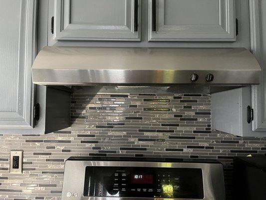 Backsplash and lighting with fan cover