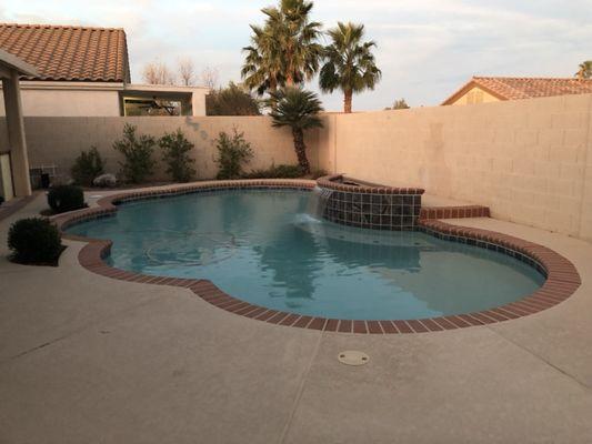 Deck tile plaster and added raised planter and waterfall.