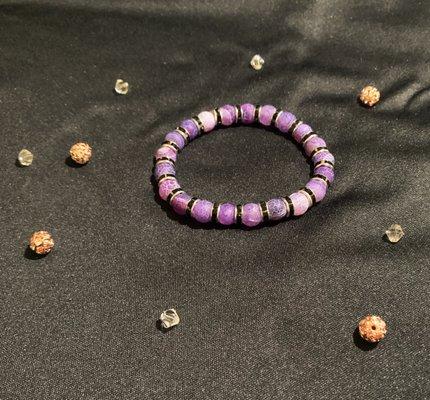 If purple gemstone is your color this 7.5 inch stretch bracelet with black and silver spacers is just right