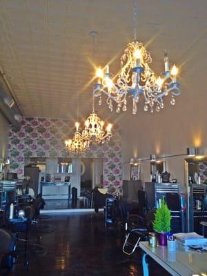 Natalie's salon! I love the wallpaper and chandeliers.