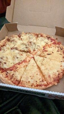 Half cheese and half sausage "well done" pizza.