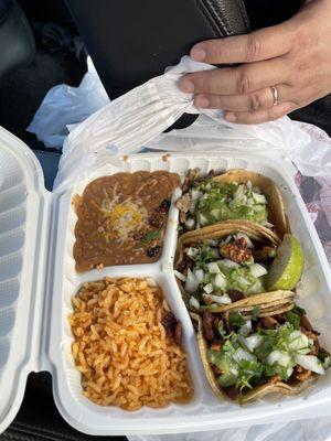 Three street tacos meal: chicken, pork, beef