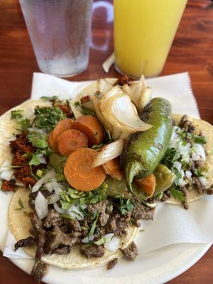 Carna asada tacos and carnitas tacos