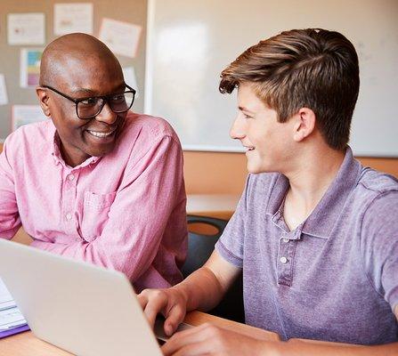 student receiving one-to-one instruction from teacher