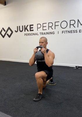 Trainer Cameron demonstrating kettlebell routines