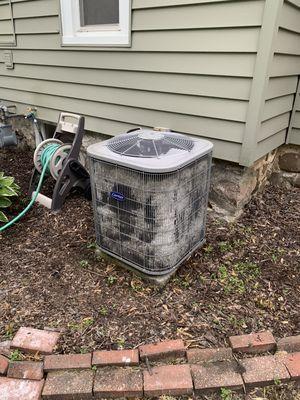 Cleaning a condenser coil in Waukesha.