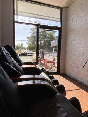 Waiting area with 3 minute massage chair for $1.