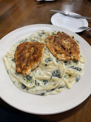 Blackened chicken fettuccine Alfredo with spinach and garlic