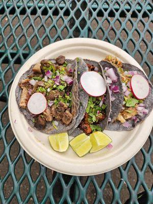 Tacos with lengua, al pastor, and carnitas