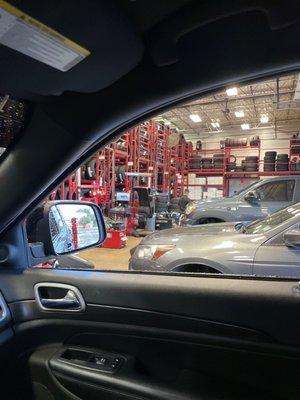 Inside the garage while they work on my tire.