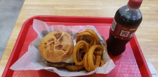 Cheese and mushrooms hamburger with onion rings and soda