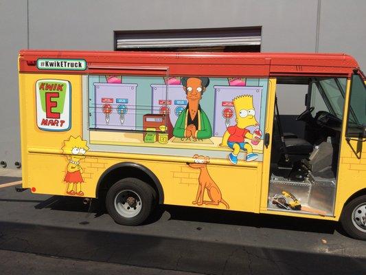 Vehicle graphics printed on adhesive vinyl - Kwik-E-Mart truck.