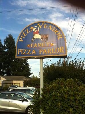 Pizza vendor sign a block off of hgwy. 30