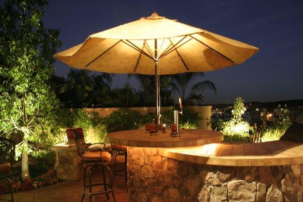 Patio lighting for this Newport Coast home adds to the usability of the BBQ areas.