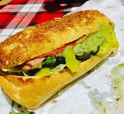 Italian on honey oat bread. Toasted with veggies and Avocado. Yum!