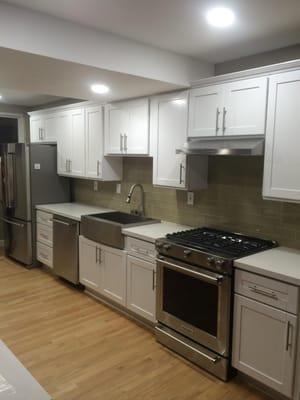 We changed the layout of this kitchen, removed some walls and did the flooring, lighting, cabinets, countertops and installed...