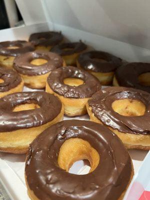 Dozen chocolate donuts