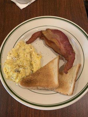 Scrambled eggs bacon and toast