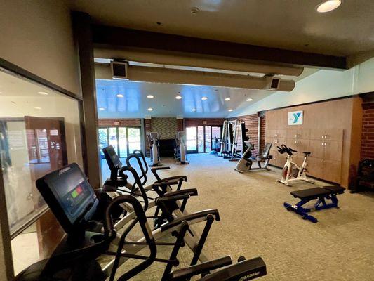 Treadmill and elliptical room with bikes & free weights