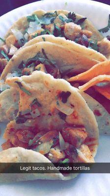 Tacos de pollo with handmade corn tortillas. (Chicken tacos)