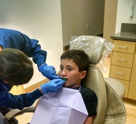 My son getting his Mouth Guard impression done for flag football.