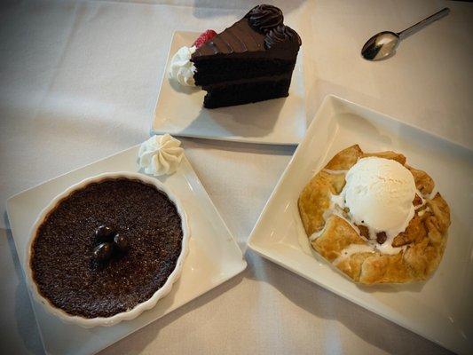 Espresso crepe brûlée, chocolate cake, peach dessert feast. We ordered extra desserts to take back to family.